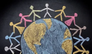 Drawing oof people holding hand on the globe