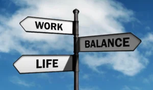 A pole with four different signs on it.